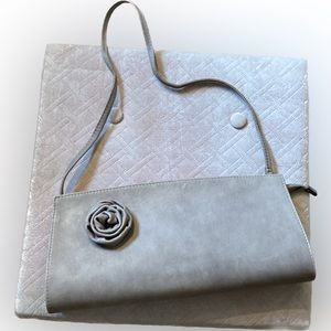 Reta latte color leather evening bag with attached gorgeous flower accent